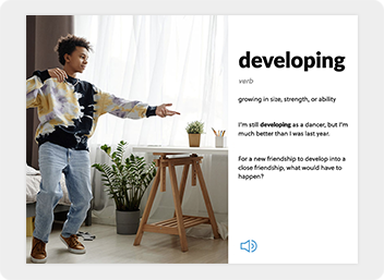 A boy dances beside the definition of the word developing