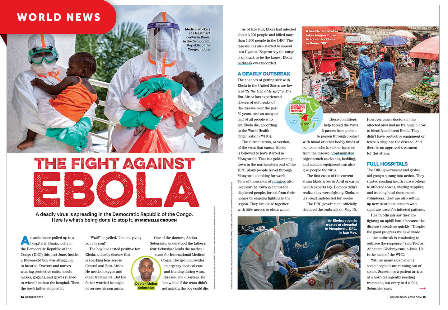 Two medical workers in protective suits hold young children at a treatment center in Bunia, DRC