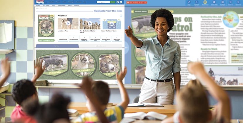 A woman leads a classroom lesson as students raise their hands in front of a Scholastic News display