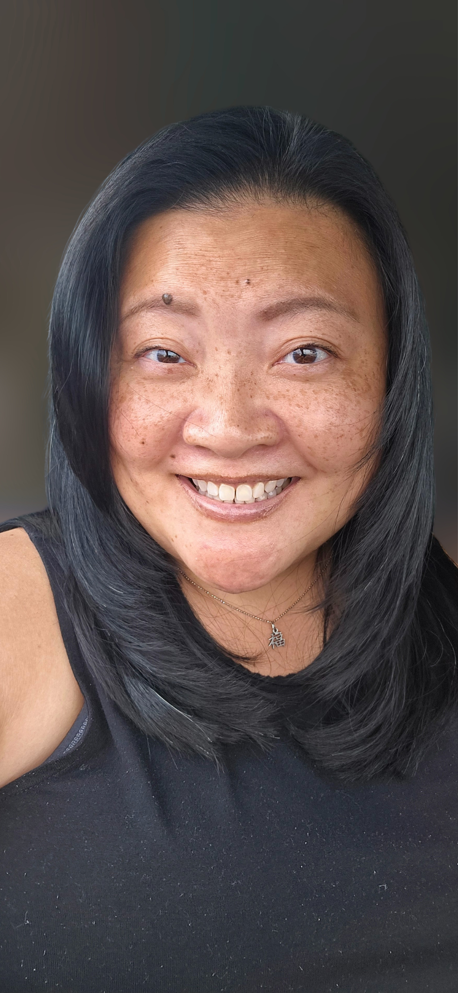 A woman faces the camera in a close portrait shot