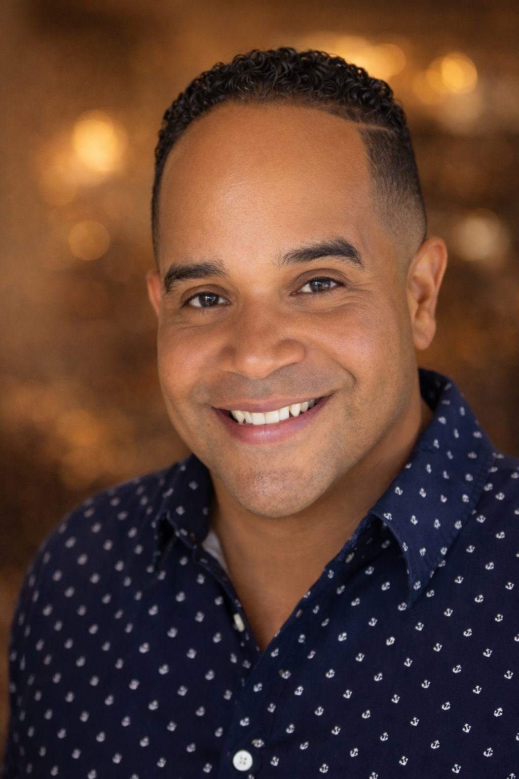 A man faces the camera in a close portrait shot